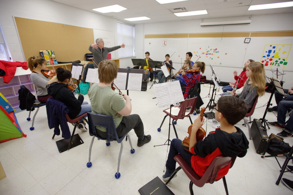 Mr. Beaton conducting